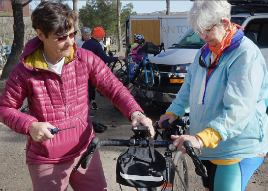 Two women preparing to go on a WomanTours bike tour vacation